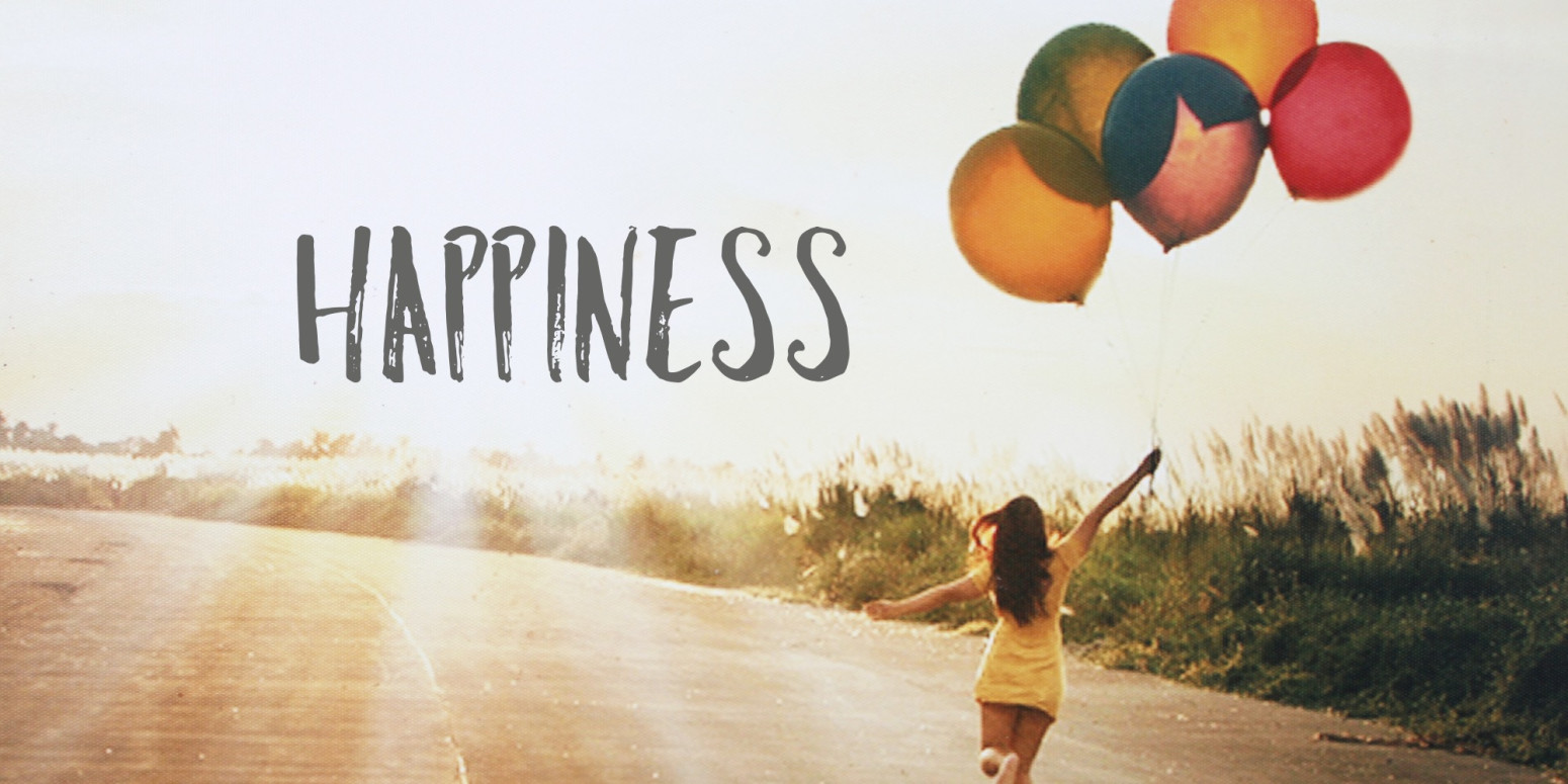 happiness - girl holding balloons